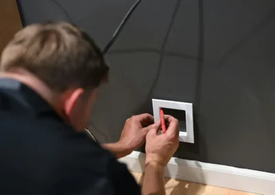 plumber checking for water leak in wall in dfw